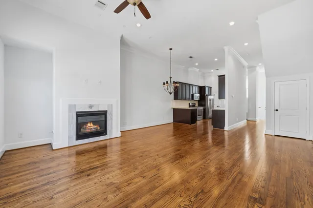 a view of kitchen and hall with wooden floor