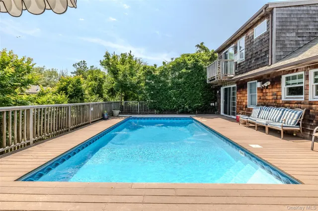 a view of swimming pool with seating space