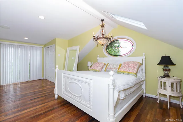 a bedroom with a bed and a chair