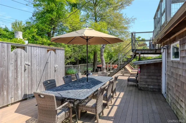 an outdoor space with furniture and umbrella