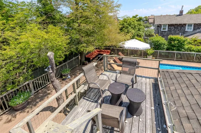 a view of a patio with iron fence