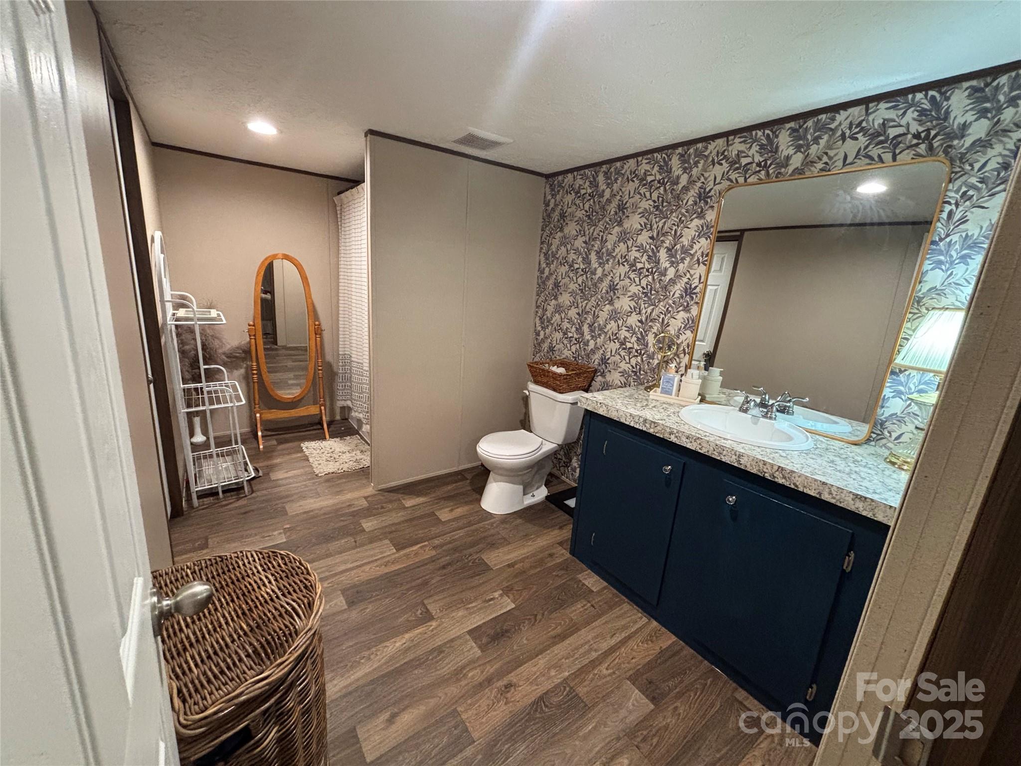 2877 Shannon Street Sharon, SC 29742 - Photo 11 of 29 a bathroom with a double vanity sink and a mirror