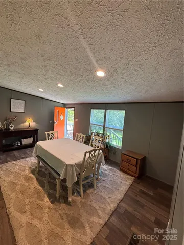 a room with pool table and windows