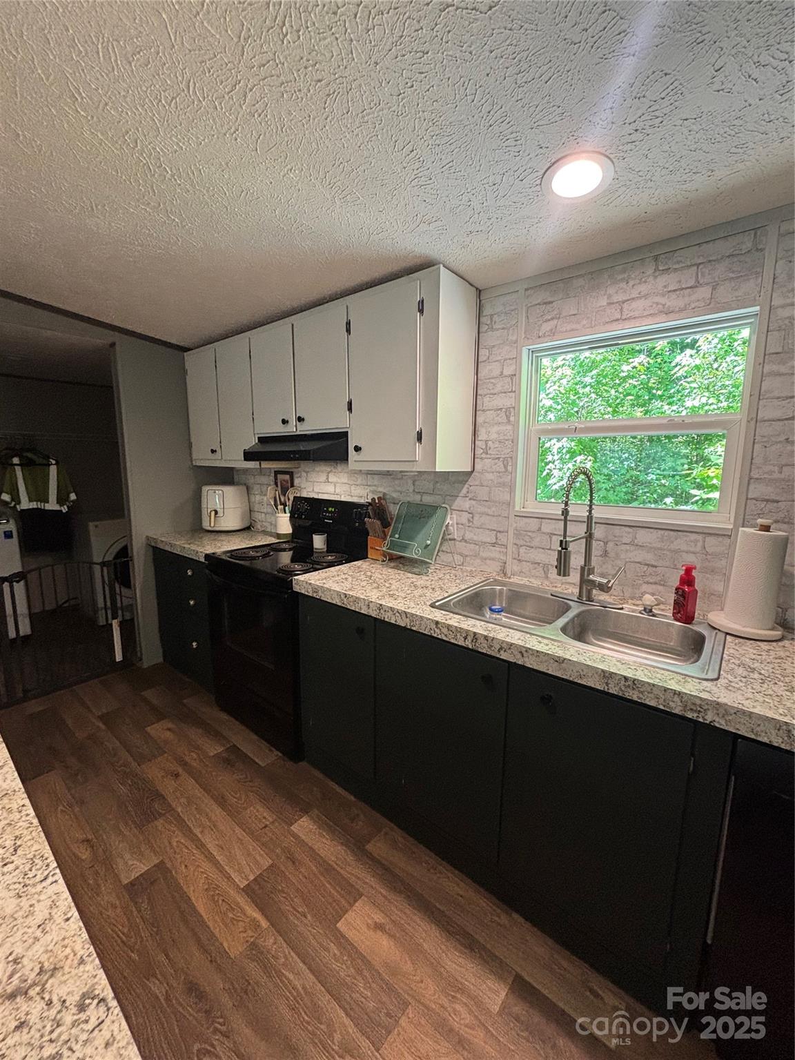2877 Shannon Street Sharon, SC 29742 - Photo 19 of 29 a kitchen with stainless steel appliances granite countertop a sink window and cabinets