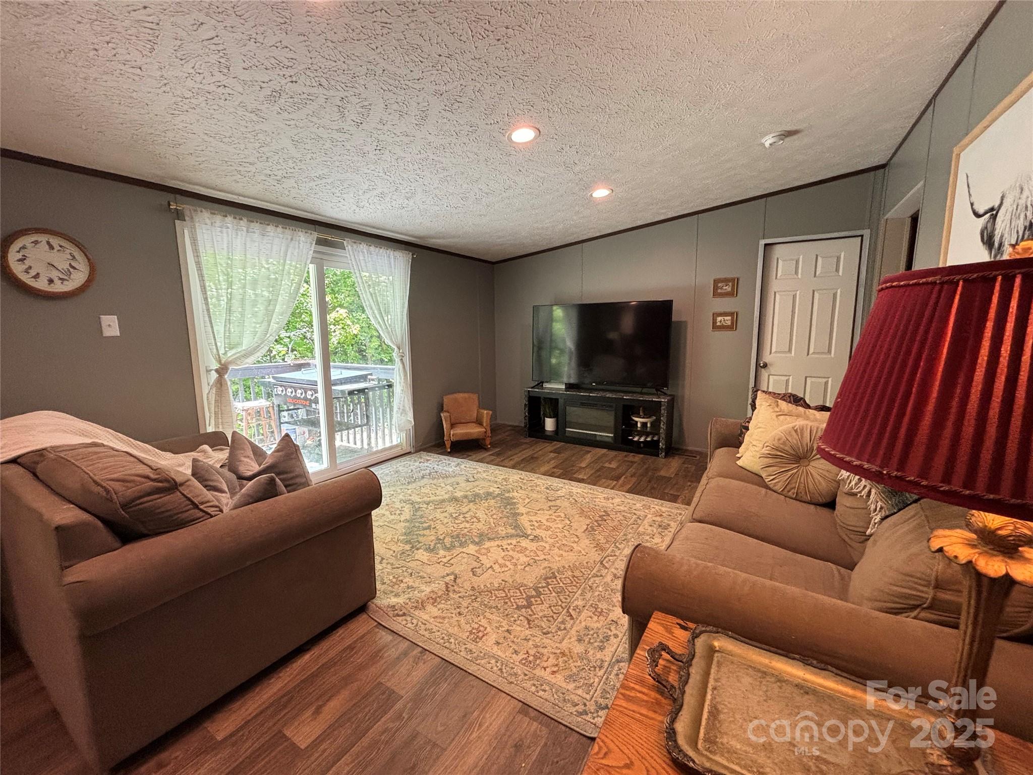 2877 Shannon Street Sharon, SC 29742 - Photo 2 of 29 a living room with furniture and a flat screen tv