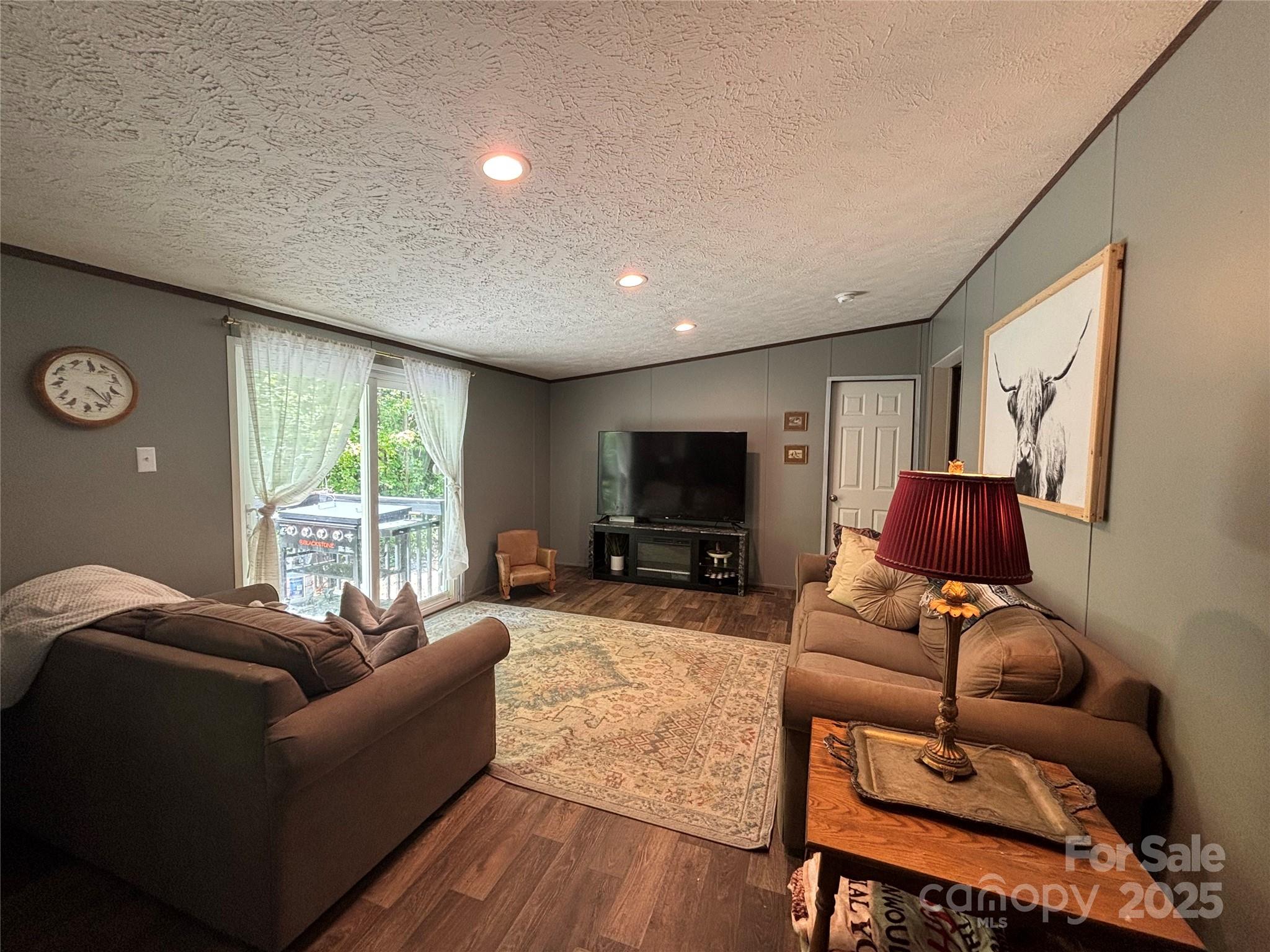2877 Shannon Street Sharon, SC 29742 - Photo 5 of 29 a living room with furniture a large window and a flat screen tv