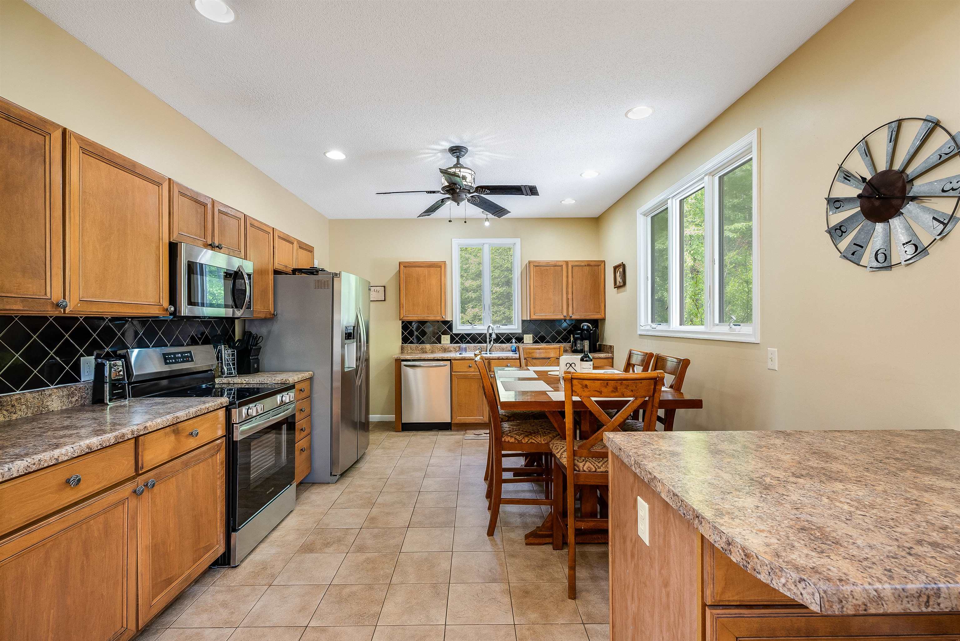 312 Rainier Road McGaheysville, VA 22840 - Photo 21 of 55 a kitchen with stainless steel appliances granite countertop sink stove top oven and cabinets