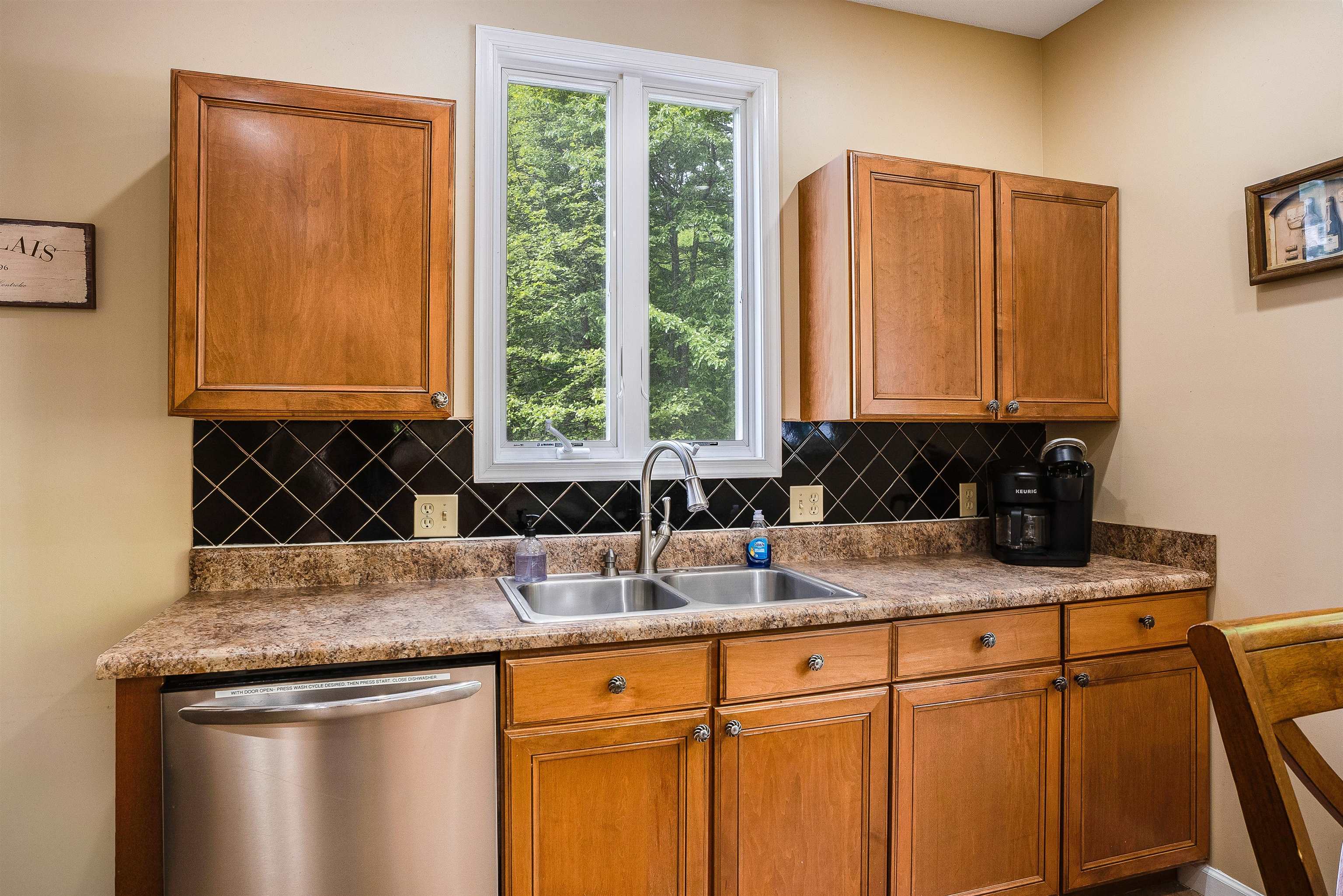 312 Rainier Road McGaheysville, VA 22840 - Photo 23 of 55 a kitchen with stainless steel appliances granite countertop white cabinets sink and window