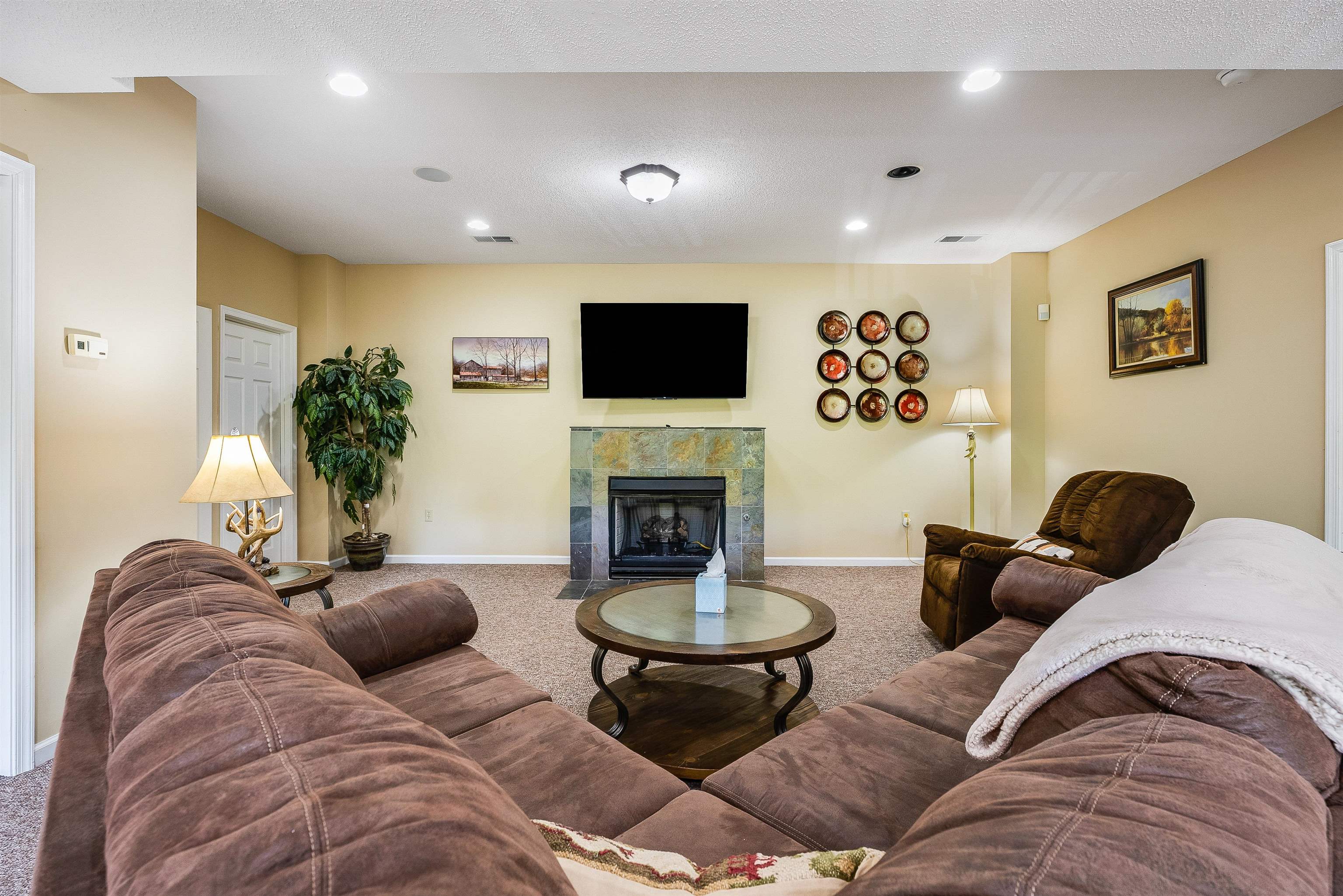 312 Rainier Road McGaheysville, VA 22840 - Photo 36 of 55 a living room with furniture a flat screen tv and a fireplace