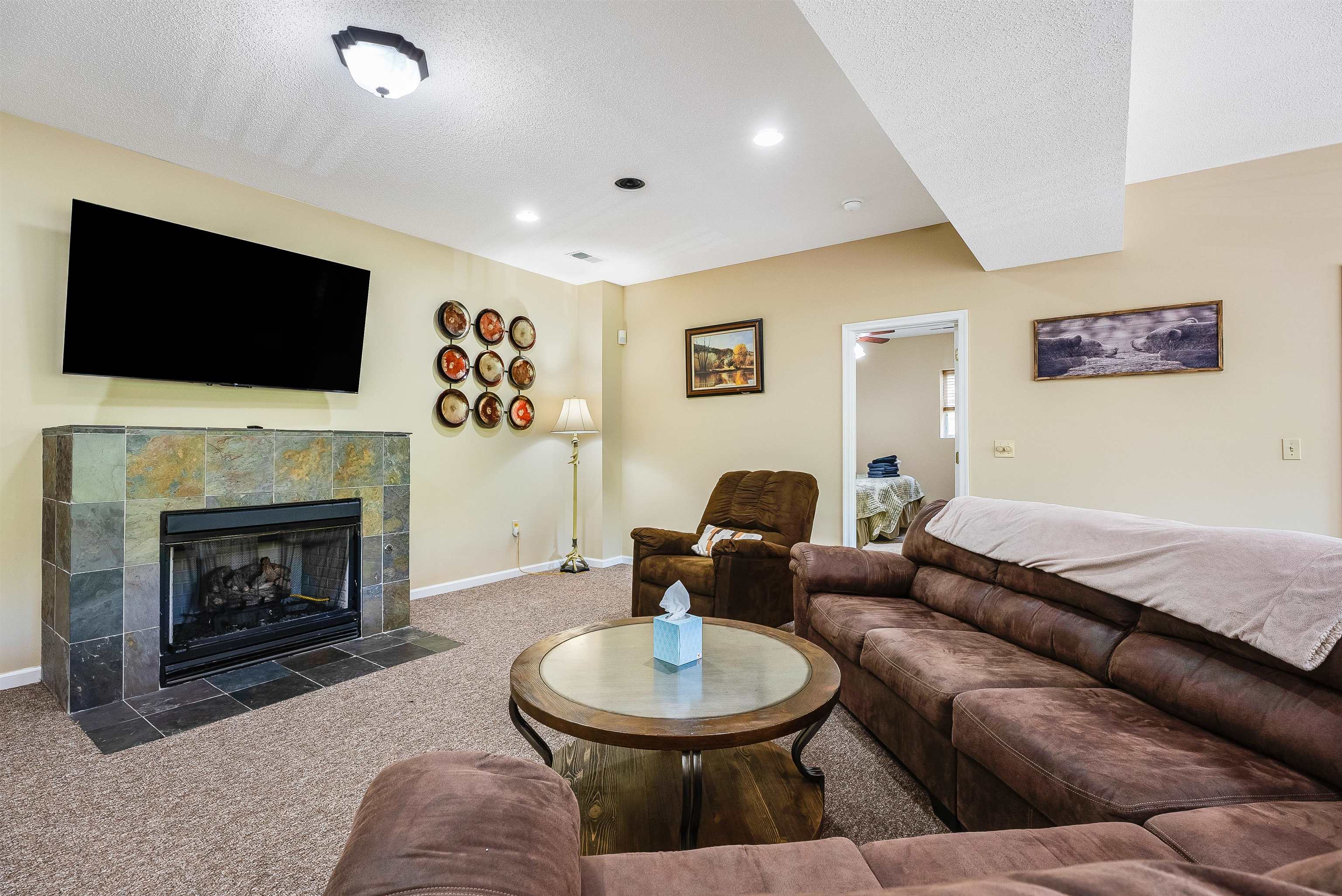 312 Rainier Road McGaheysville, VA 22840 - Photo 37 of 55 a living room with furniture a flat screen tv and a fireplace