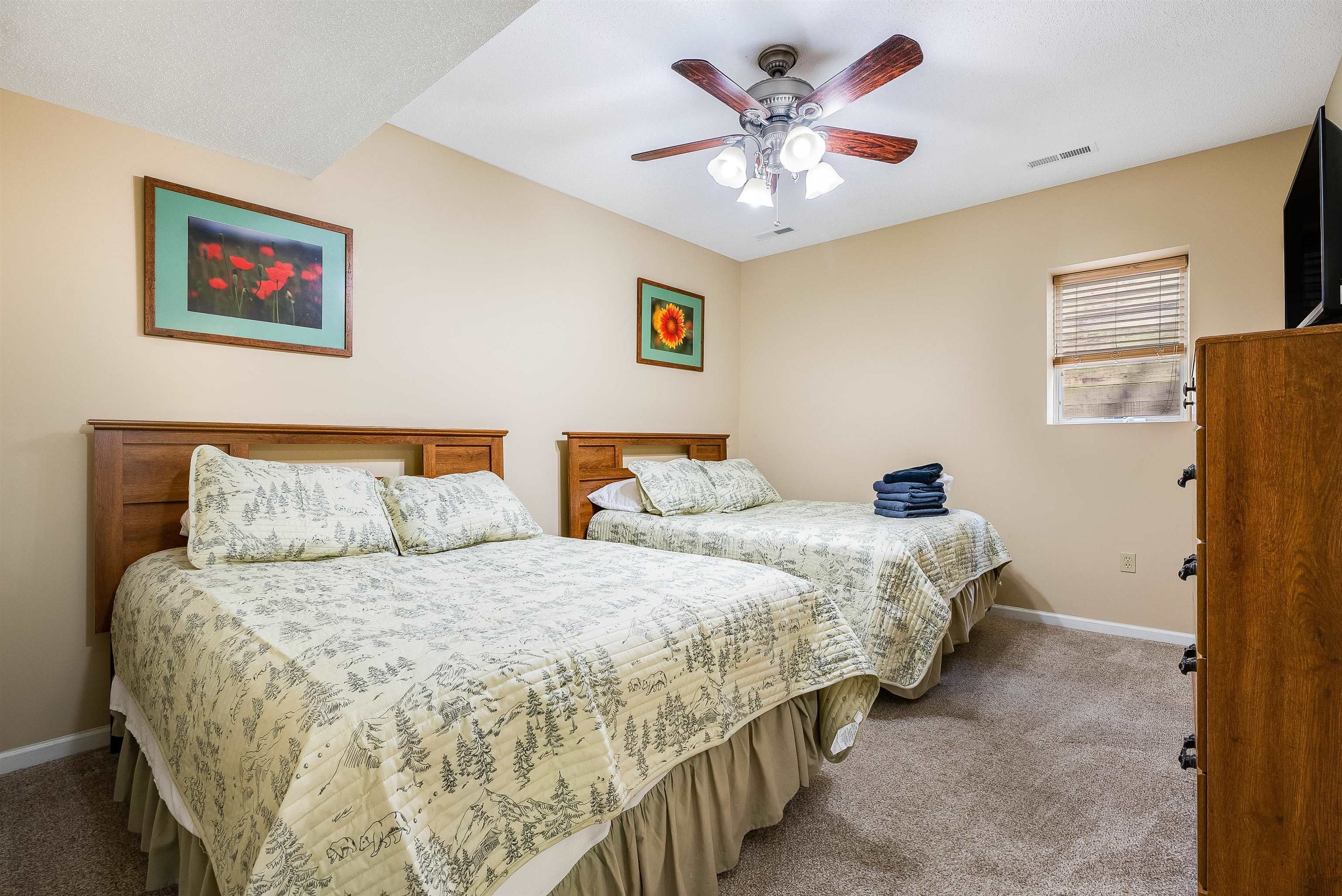 312 Rainier Road McGaheysville, VA 22840 - Photo 43 of 55 a bedroom with two beds and a chandelier