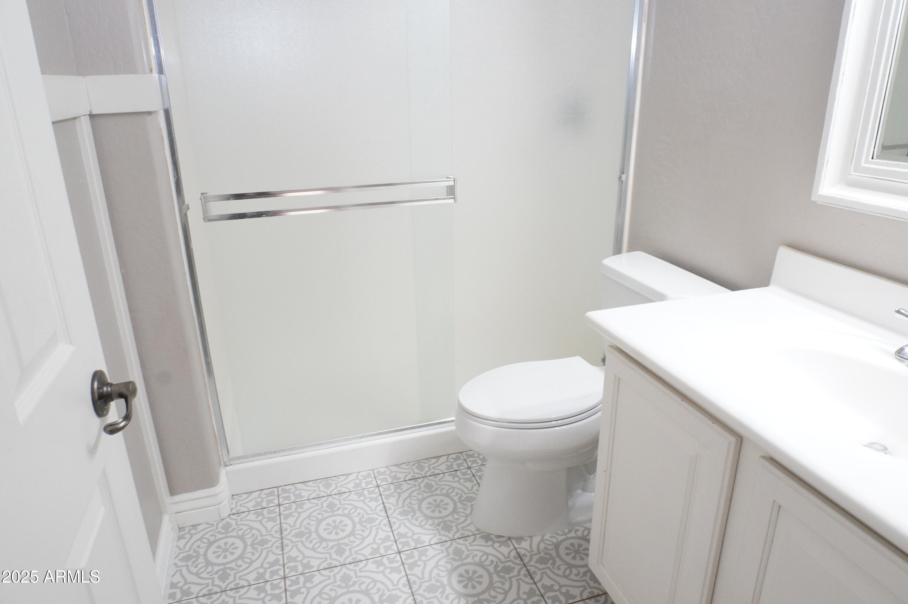 6700 South Agate Way Chandler, AZ 85249 - Photo 13 of 32 a white toilet sitting next to a bath tub