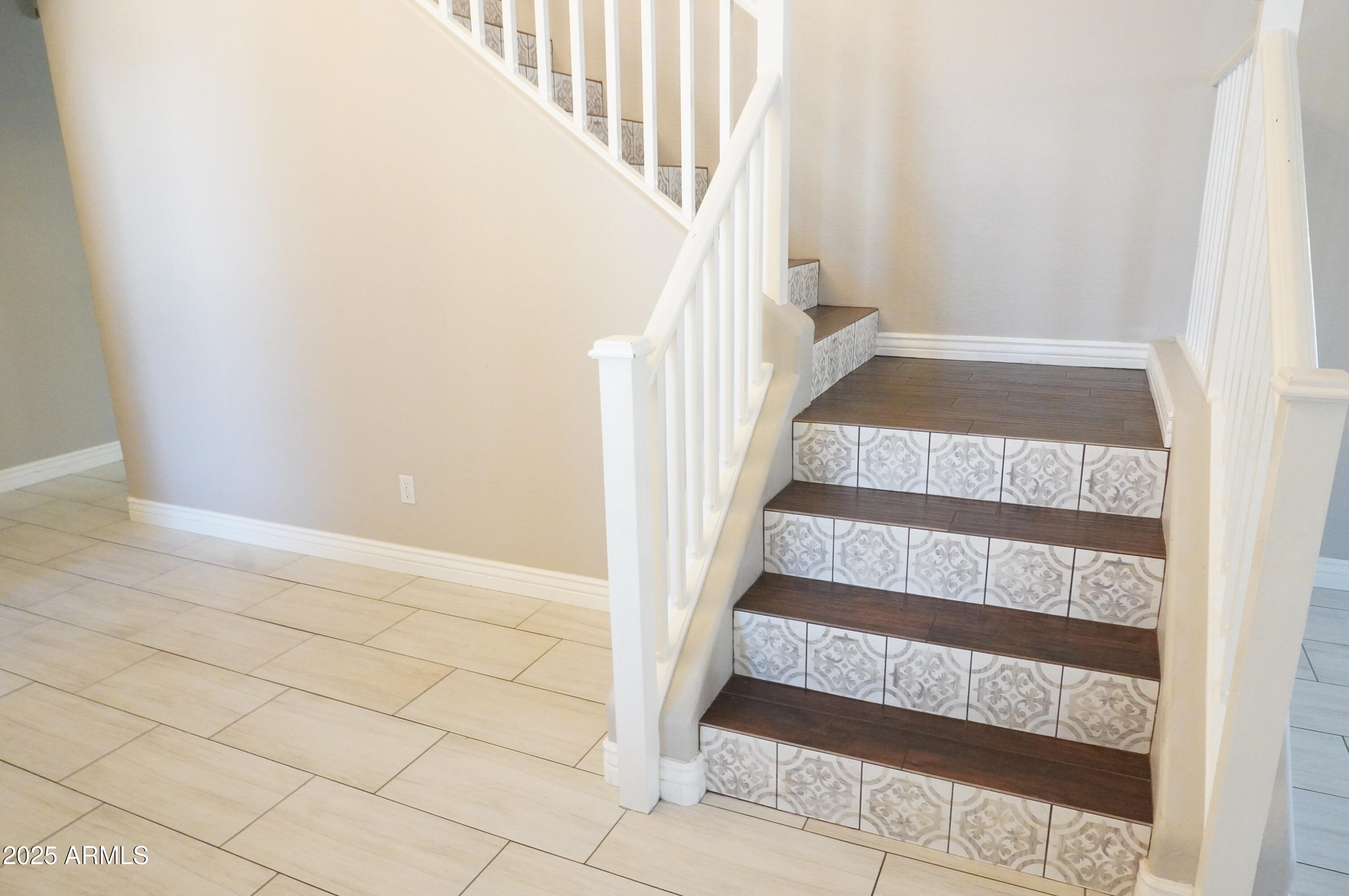 6700 South Agate Way Chandler, AZ 85249 - Photo 15 of 32 a view of staircase with white walls and windows