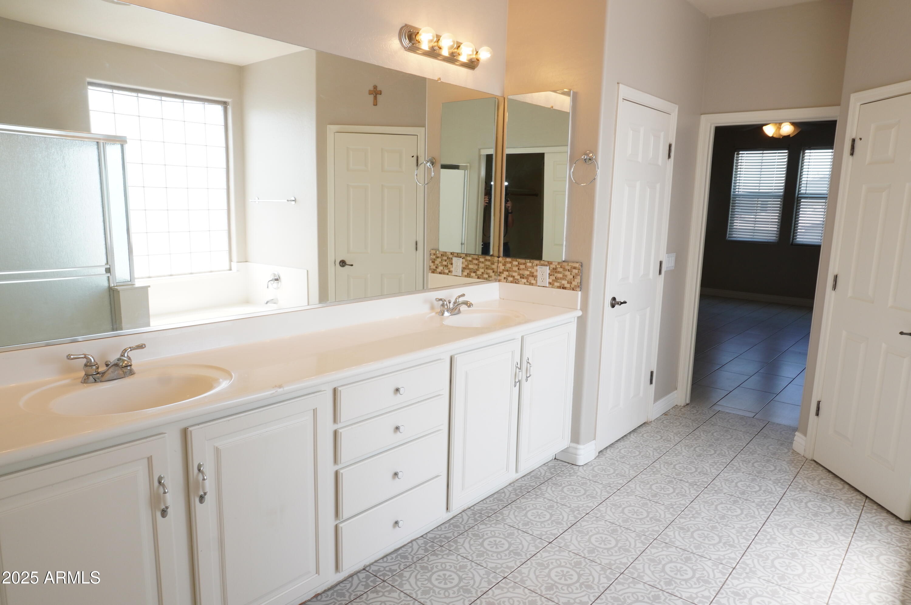6700 South Agate Way Chandler, AZ 85249 - Photo 19 of 32 a spacious bathroom with a granite countertop sink mirror and double