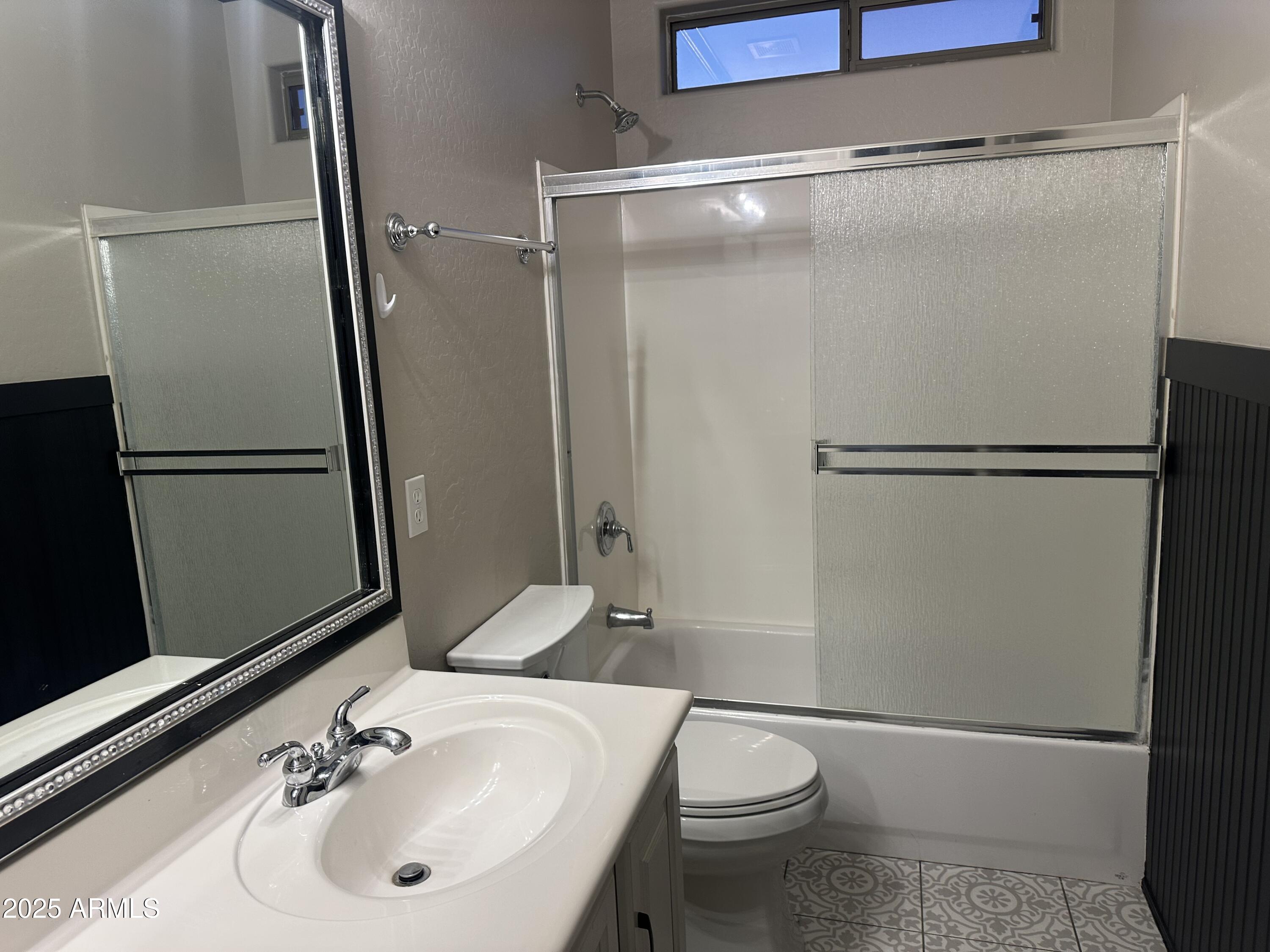 6700 South Agate Way Chandler, AZ 85249 - Photo 31 of 32 a bathroom with a sink toilet and a mirror