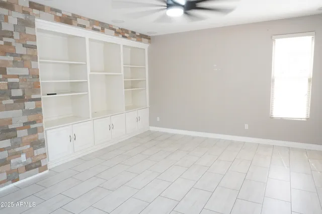 an empty room with cabinet