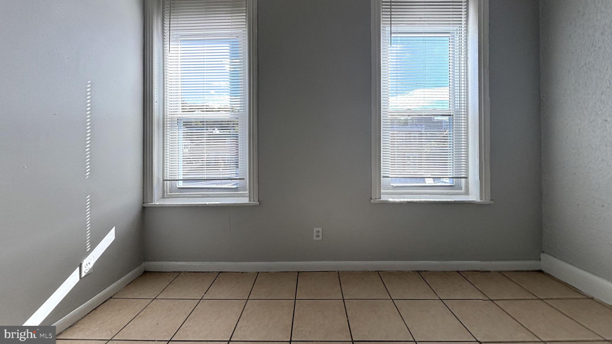 363 East Chelten Avenue, Unit 2 Philadelphia, PA 19144 - Photo 5 of 8 an empty room with windows