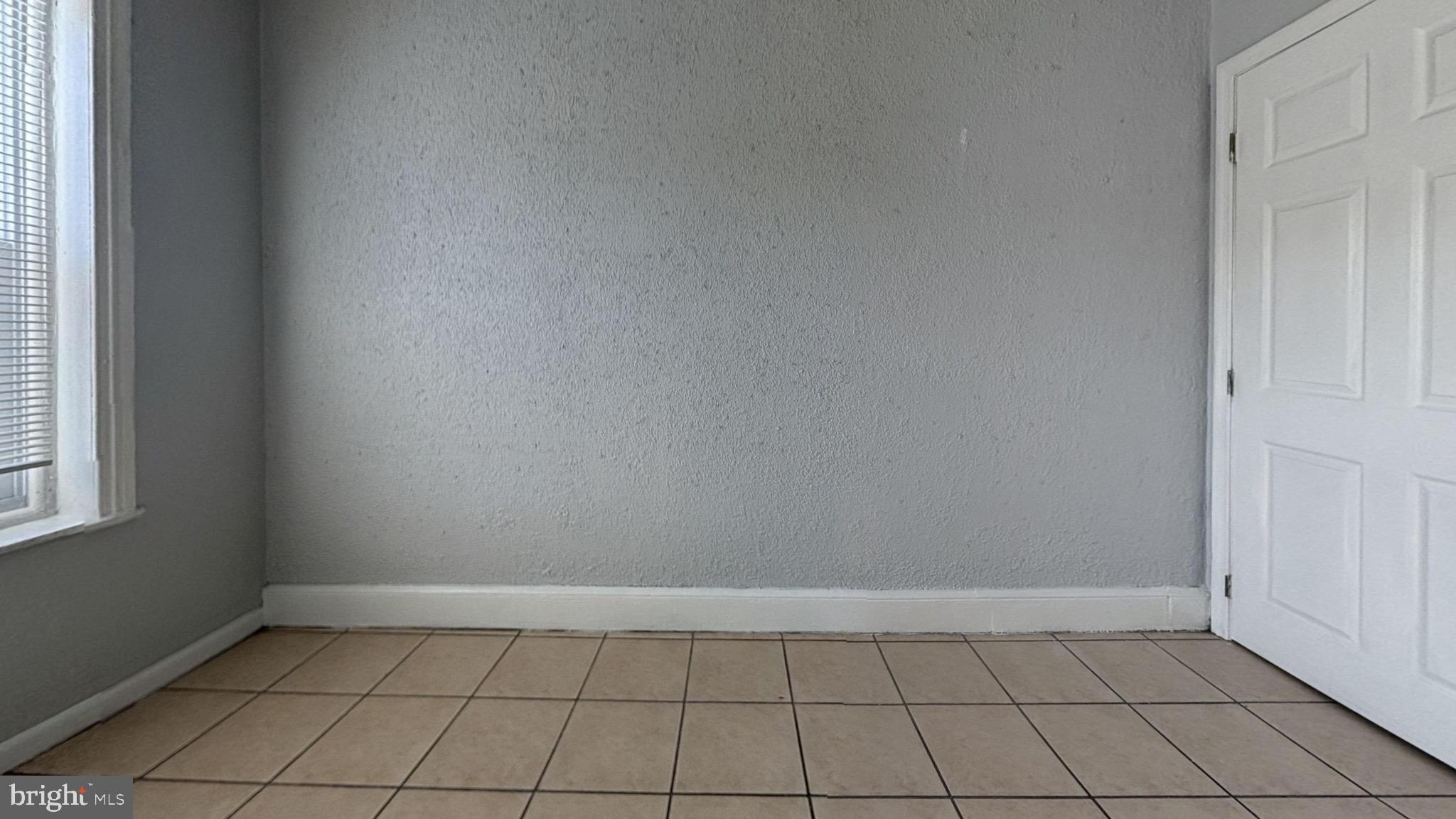 363 East Chelten Avenue, Unit 2 Philadelphia, PA 19144 - Photo 6 of 8 a view of an empty room and window