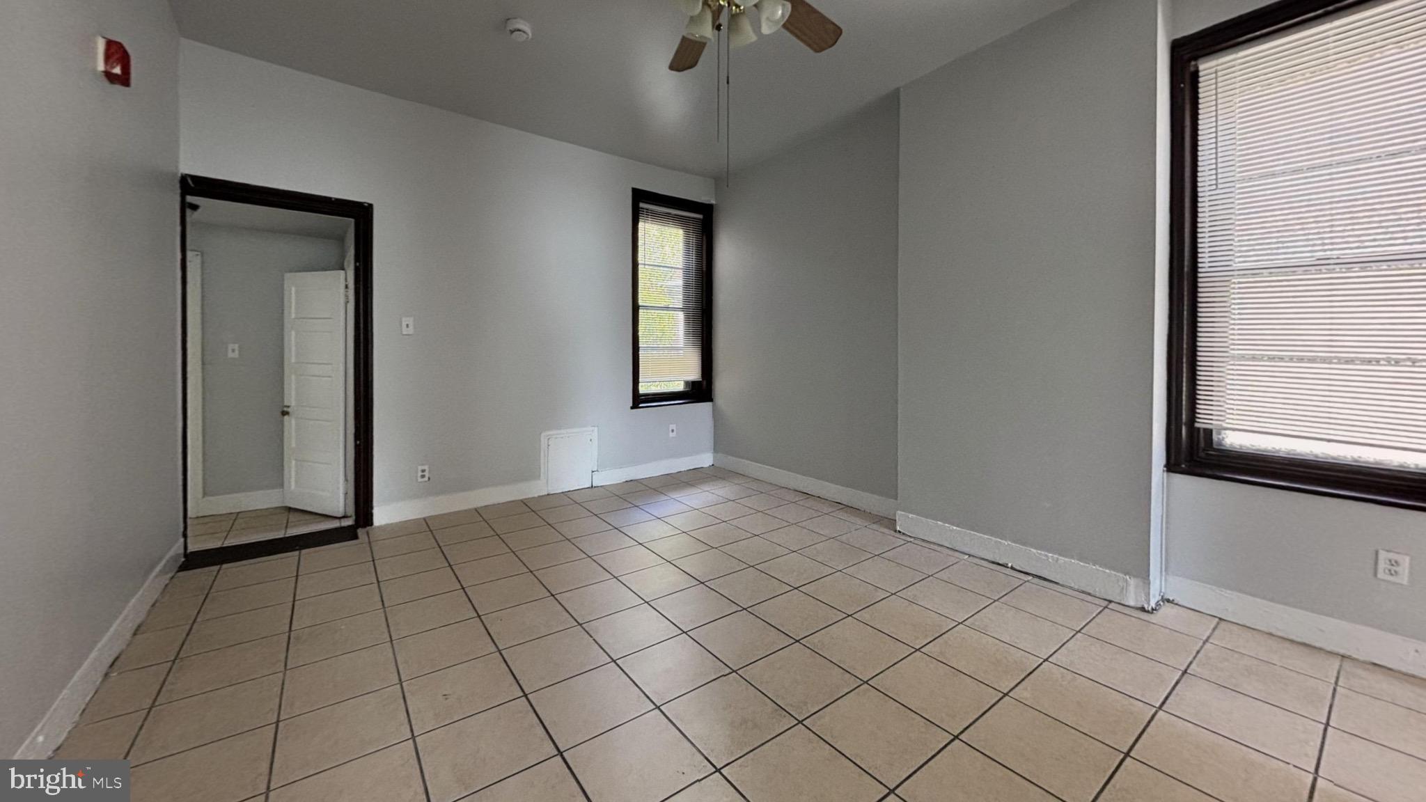 363 East Chelten Avenue, Unit 2 Philadelphia, PA 19144 - Photo 7 of 8 a view of an empty room and window