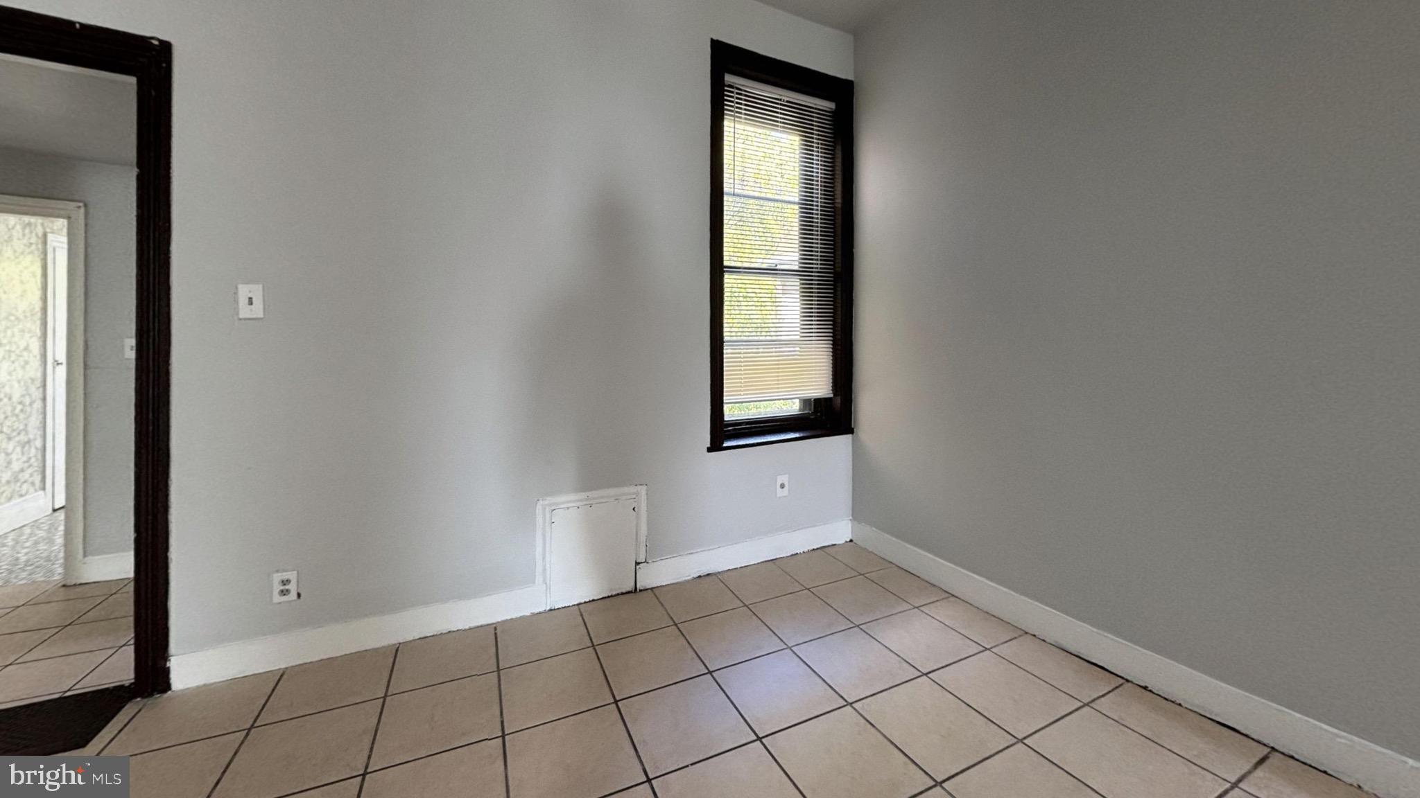 363 East Chelten Avenue, Unit 2 Philadelphia, PA 19144 - Photo 8 of 8 a view of an empty room and window