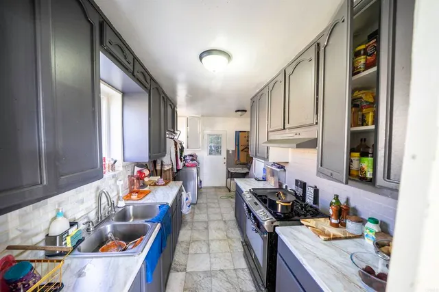 a room with furniture a rug and a window