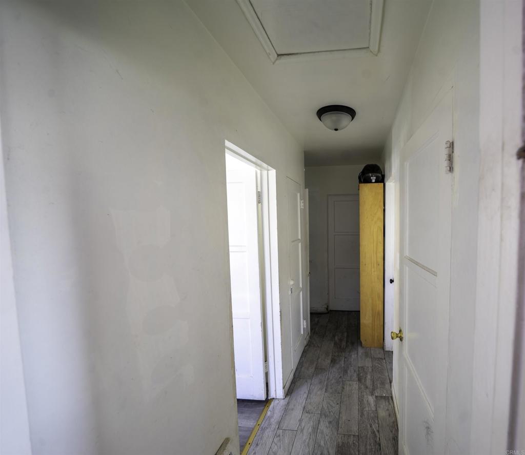 7513 Pivot Street Downey, CA 90241 - Photo 6 of 11 a view of a hallway with wooden floor