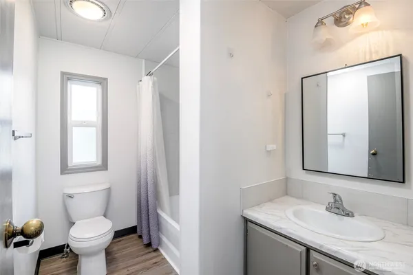 a view of a wooden deck with a bench