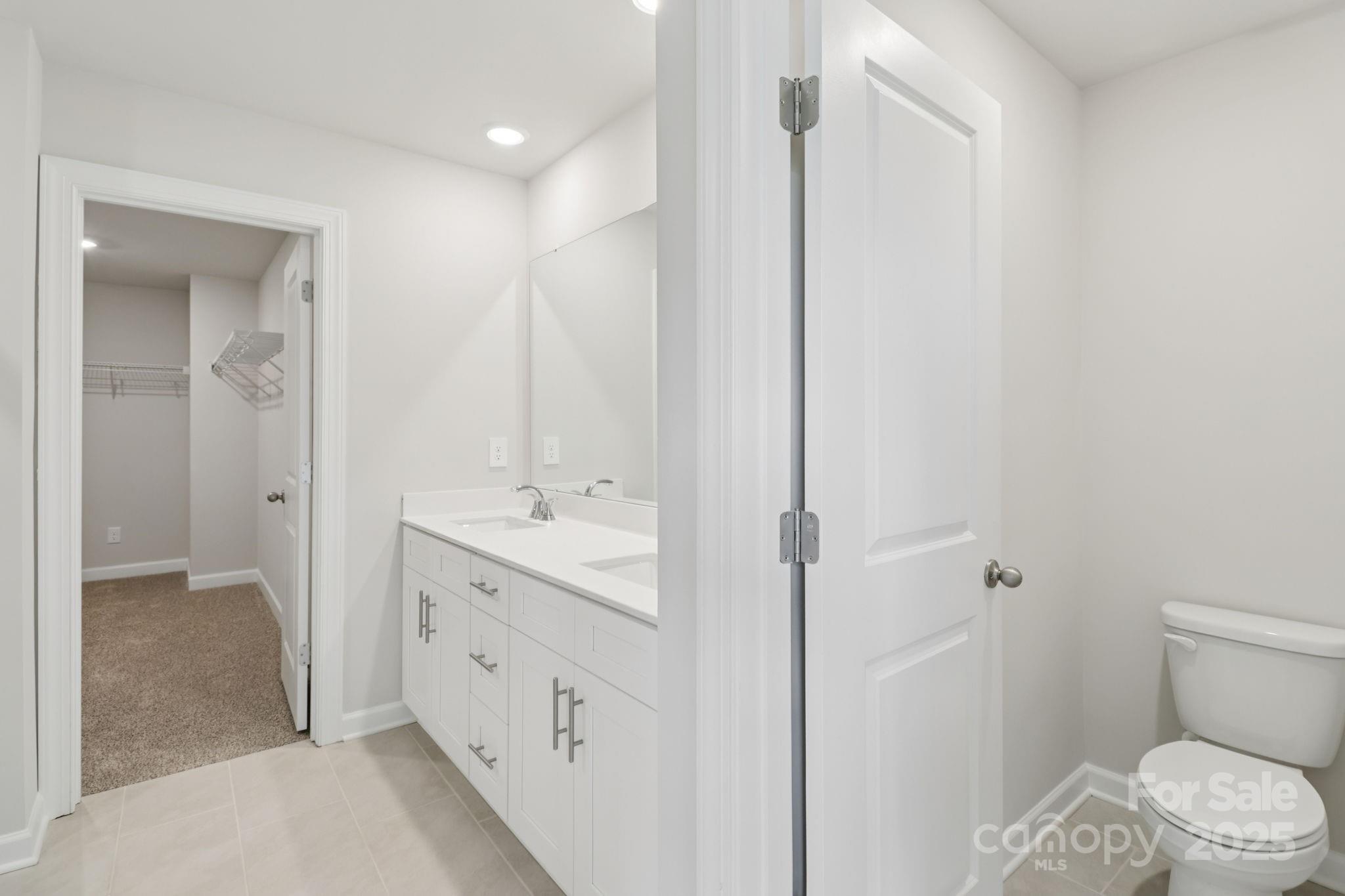 172 Murphy Mdw Road Mocksville, NC 27028 - Photo 14 of 22 a bathroom with a double vanity sink toilet and shower