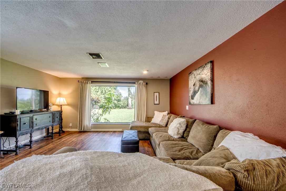 3651 Putter Point Lane Fort Myers, FL 33919 - Photo 14 of 33 a living room with furniture and a flat screen tv