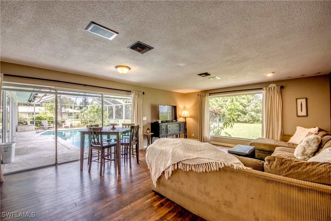 3651 Putter Point Lane Fort Myers, FL 33919 - Photo 15 of 33 a large bedroom with a bed and large windows
