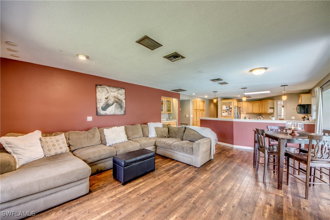 3651 Putter Point Lane Fort Myers, FL 33919 - Photo 16 of 33 a living room with furniture and wooden floor