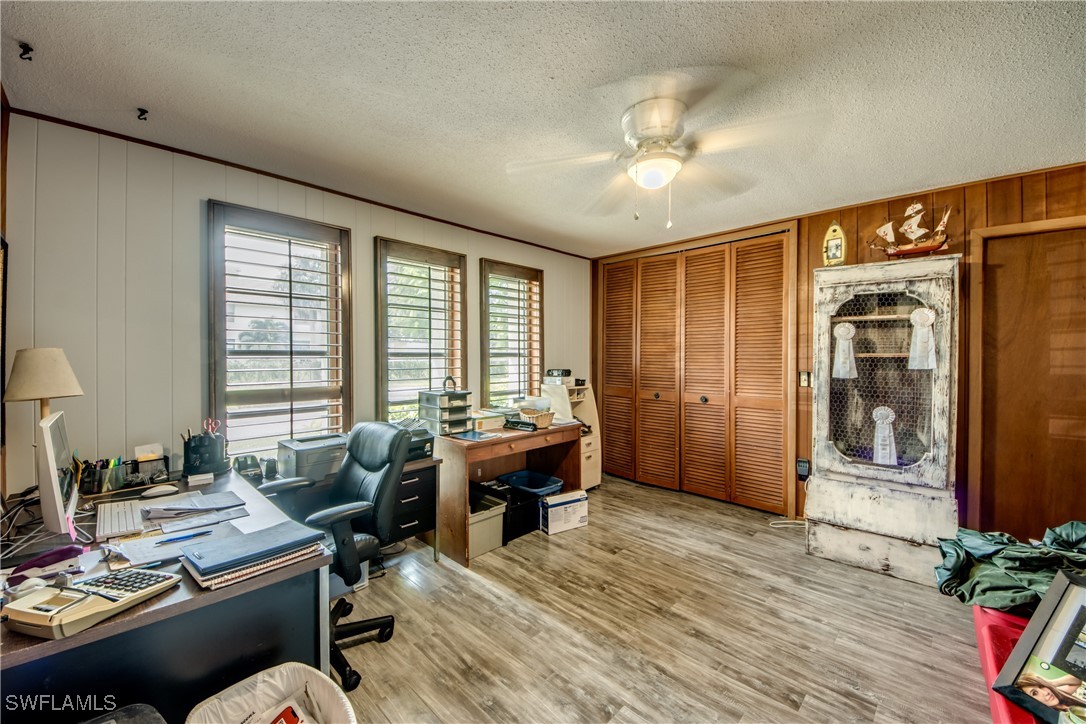 3651 Putter Point Lane Fort Myers, FL 33919 - Photo 22 of 33 a workspace with furniture window and wooden floor