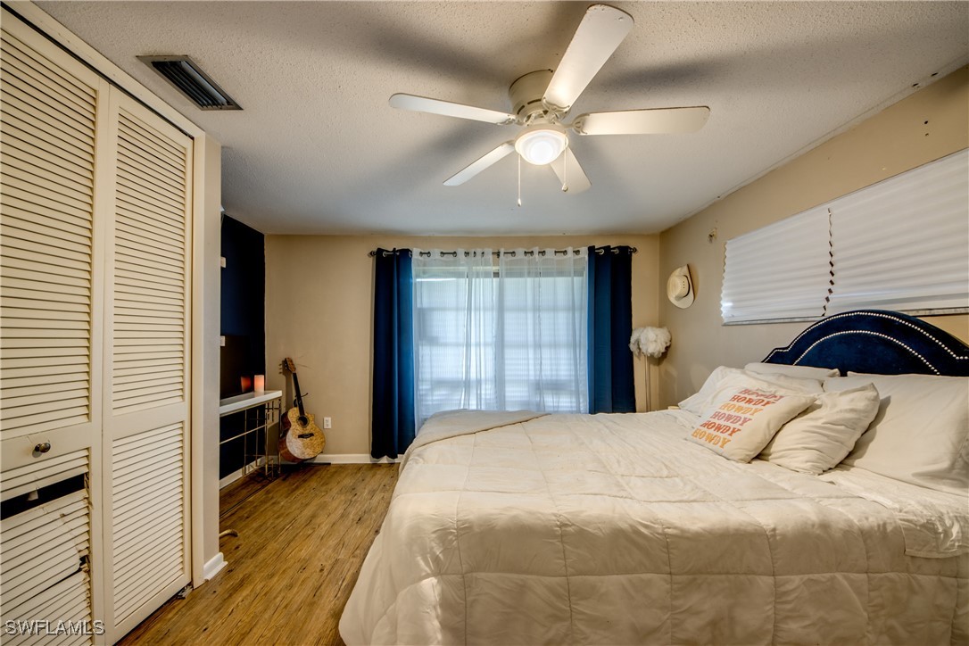 3651 Putter Point Lane Fort Myers, FL 33919 - Photo 26 of 33 a bedroom with a bed and a window