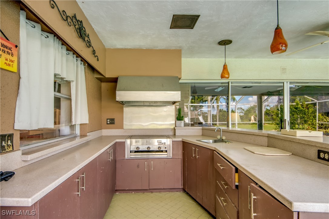 3651 Putter Point Lane Fort Myers, FL 33919 - Photo 28 of 33 a kitchen with a sink and a large window