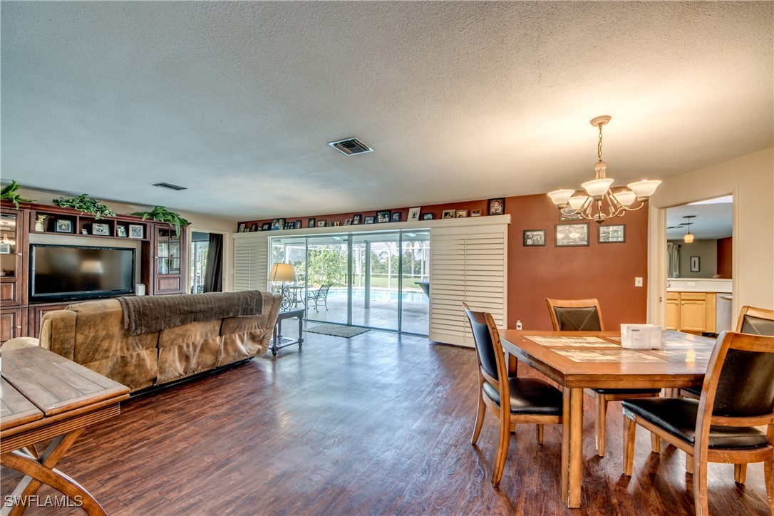 3651 Putter Point Lane Fort Myers, FL 33919 - Photo 4 of 33 a living room with furniture and wooden floor