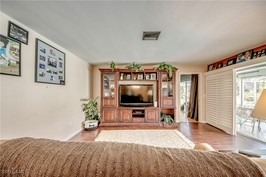 3651 Putter Point Lane Fort Myers, FL 33919 - Photo 6 of 33 a living room with furniture and a flat screen tv