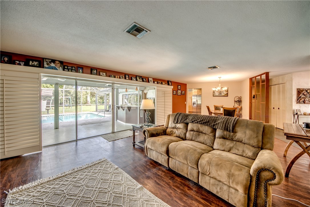3651 Putter Point Lane Fort Myers, FL 33919 - Photo 9 of 33 a living room with furniture and a large window