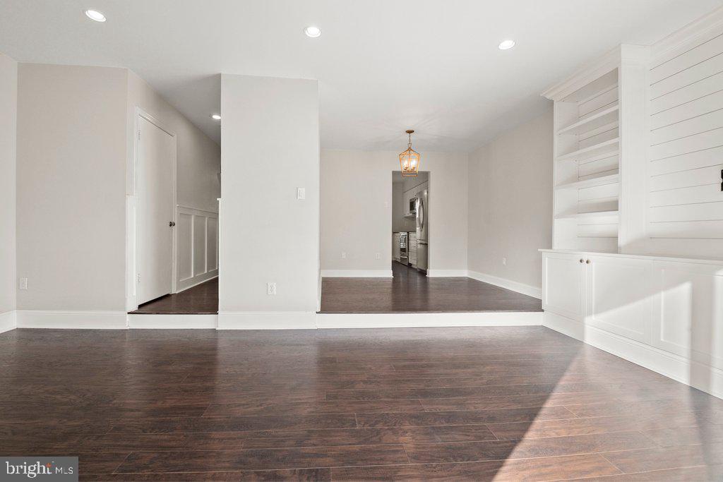 7472 Setting Sun Way Columbia, MD 21046 - Photo 20 of 40 a view of empty room with wooden floor