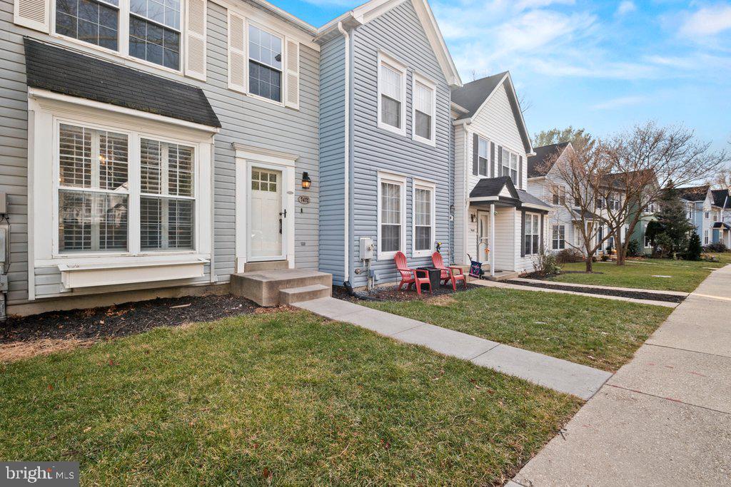 7472 Setting Sun Way Columbia, MD 21046 - Photo 2 of 40 a front view of a house with a yard