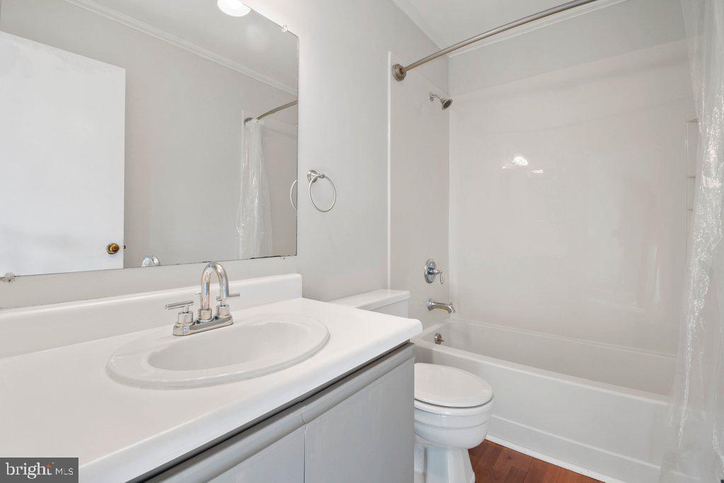 7472 Setting Sun Way Columbia, MD 21046 - Photo 27 of 40 a bathroom with a sink toilet and shower