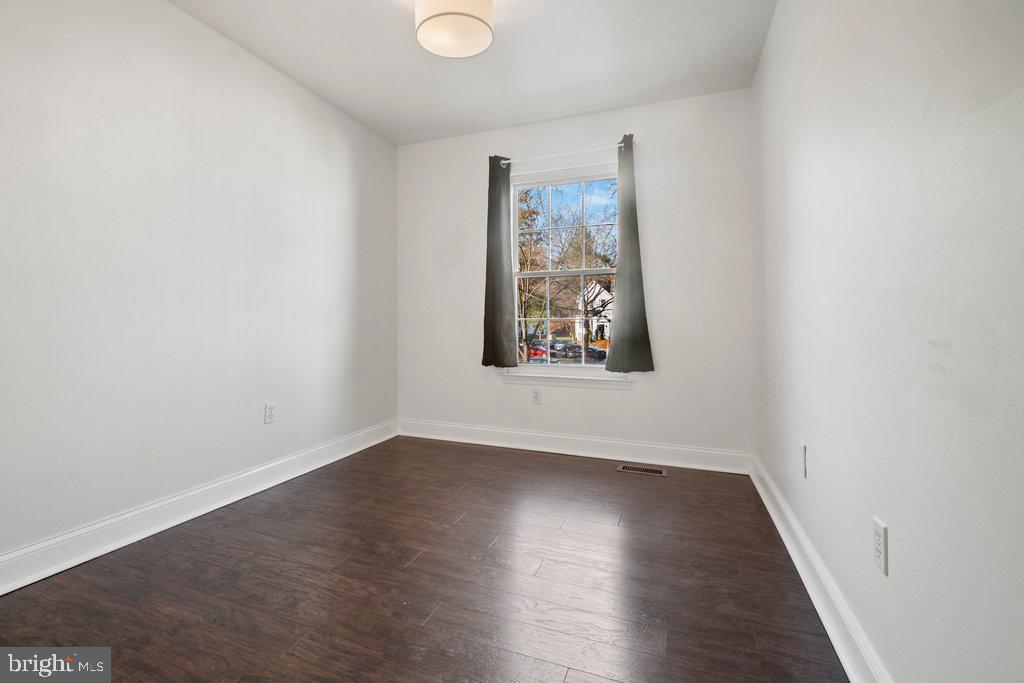 7472 Setting Sun Way Columbia, MD 21046 - Photo 31 of 40 an empty room with wooden floor and window