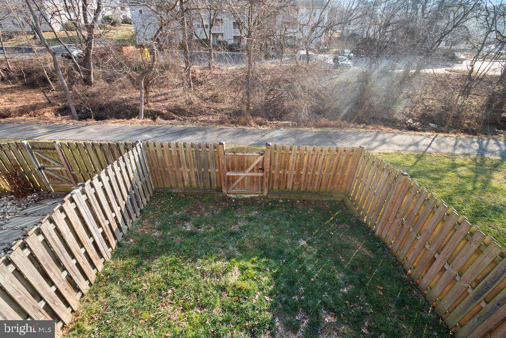 7472 Setting Sun Way Columbia, MD 21046 - Photo 38 of 40 a view of a backyard with wooden fence