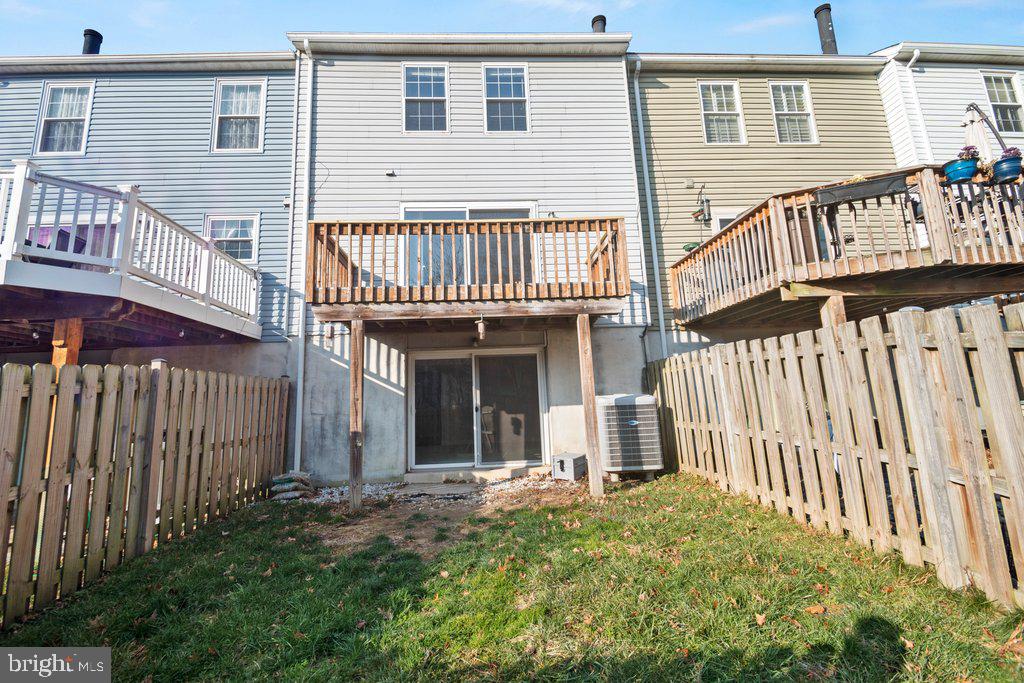 7472 Setting Sun Way Columbia, MD 21046 - Photo 39 of 40 a view of a house with wooden deck and furniture