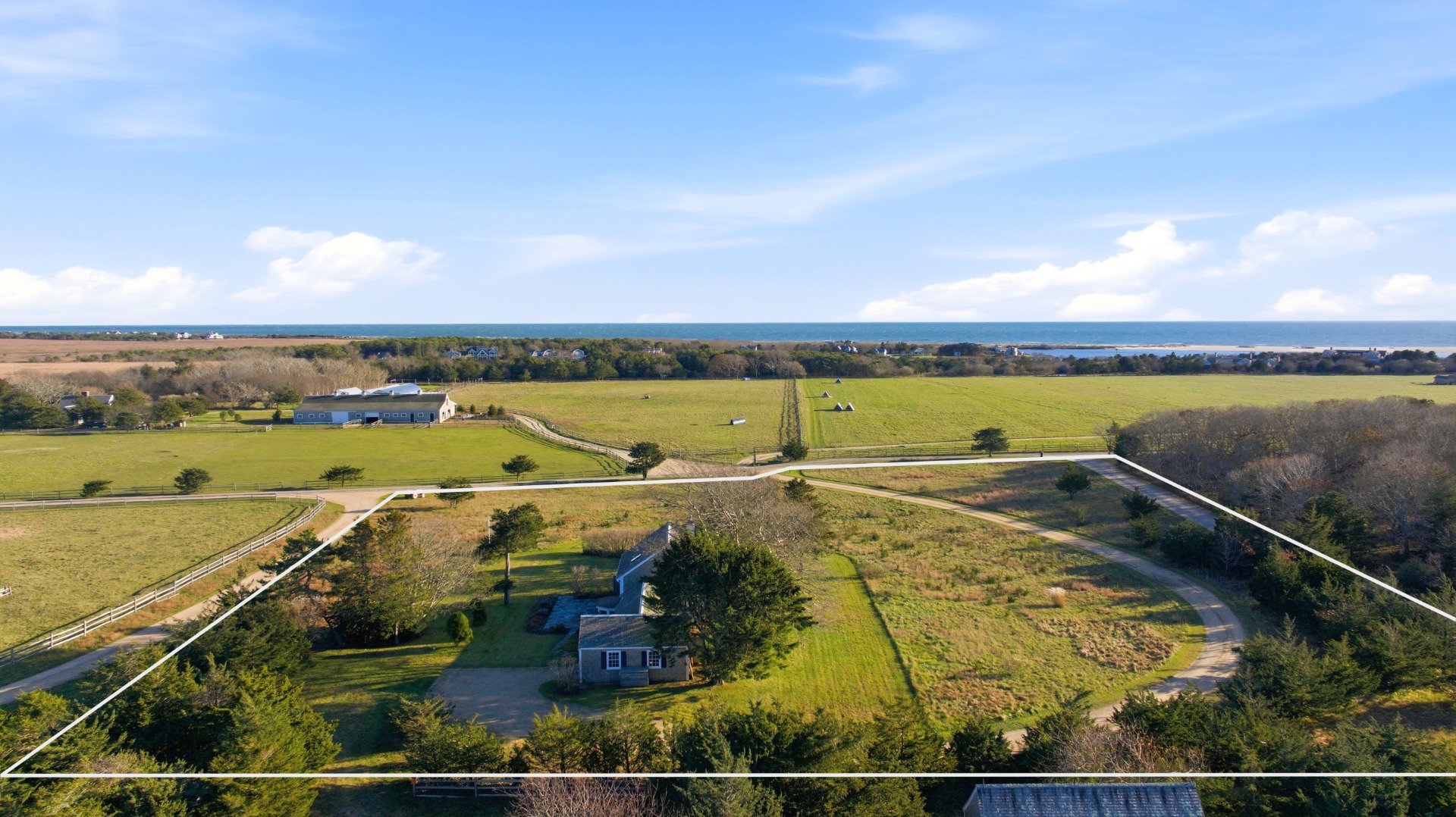 31 Butler's Cove Road Edgartown, MA 02539 - Photo 22 of 24 a view of an ocean and city