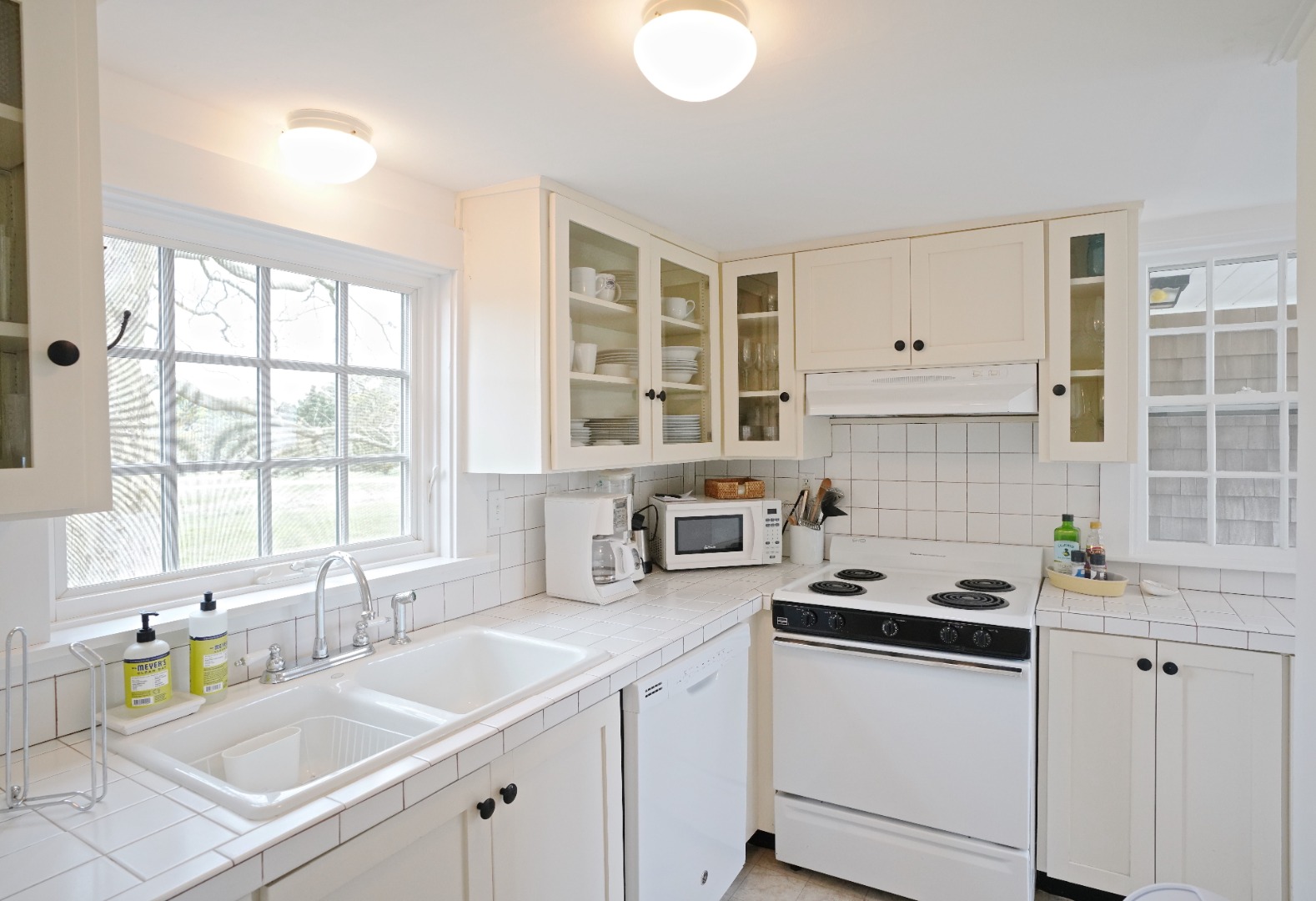 31 Butler's Cove Road Edgartown, MA 02539 - Photo 3 of 24 a kitchen with a sink cabinets and window