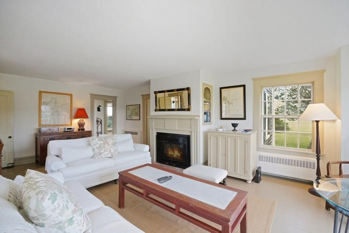 31 Butler's Cove Road Edgartown, MA 02539 - Photo 4 of 24 a living room with furniture and a fireplace