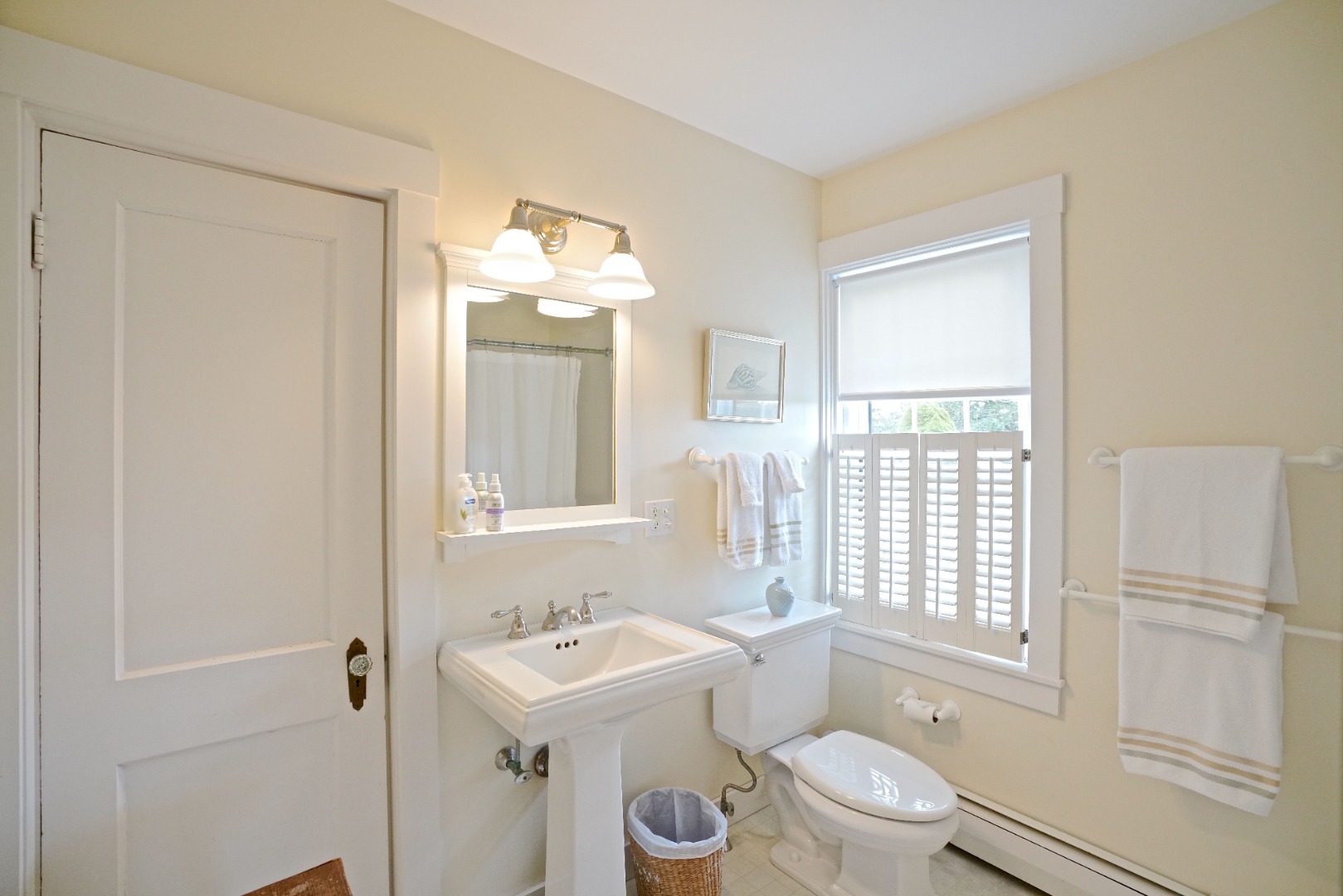 31 Butler's Cove Road Edgartown, MA 02539 - Photo 8 of 24 a bathroom with a sink toilet vanity and shower