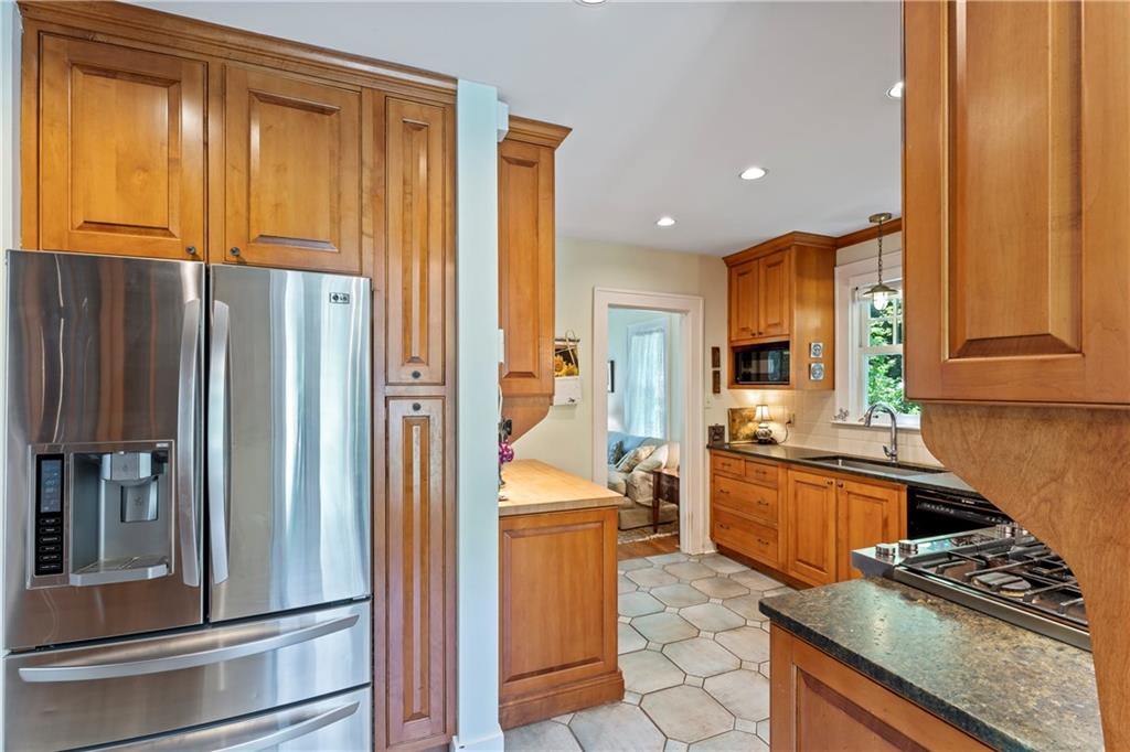 566 Dorseyville Road Pittsburgh, PA 15238 - Photo 12 of 48 a kitchen with stainless steel appliances granite countertop a refrigerator and a stove top oven