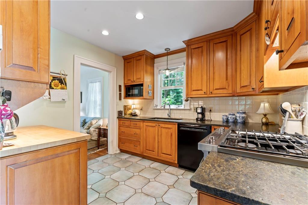 566 Dorseyville Road Pittsburgh, PA 15238 - Photo 13 of 48 a kitchen with a sink a stove and cabinets