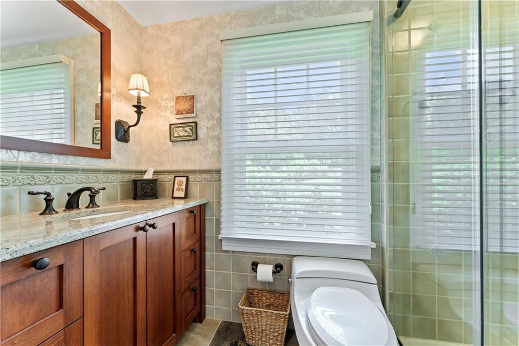 566 Dorseyville Road Pittsburgh, PA 15238 - Photo 17 of 48 a bathroom with a granite countertop sink toilet and mirror